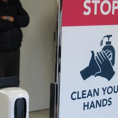 Picture of a sign asking people to wash their hands