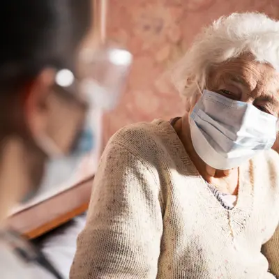 Picture of an older woman sick with influenza