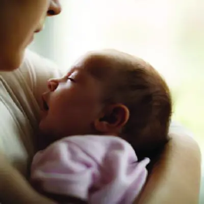 Mother holding newborn baby