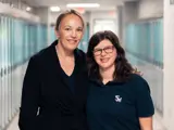 Teacher and student smiling, link to Vital Perspectives web page about belonging and health